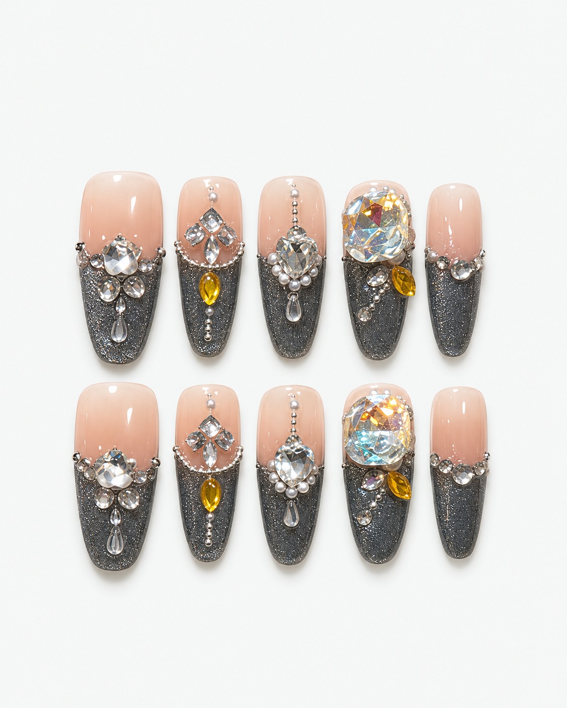 Handmade nude and smoky grey almond press-on nails with oversized iridescent crystals and rhinestone detailing