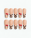Leopard Kitty long coffin press-on nails with leopard print and ruby-red bow accents