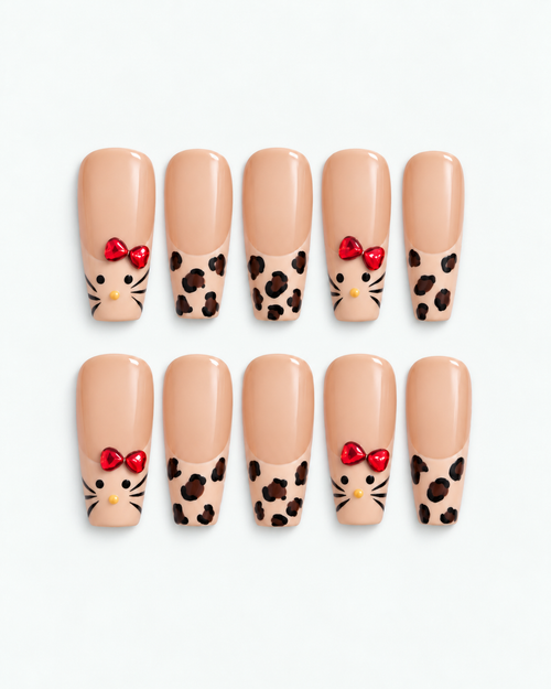 Leopard Kitty long coffin press-on nails with leopard print and ruby-red bow accents
