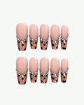 Handmade nude pink leopard press-on nails with crystal edging in long coffin and oval shapes