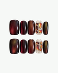 Handmade burgundy brown short squoval press-on nails with cat-eye shimmer and crystal accent