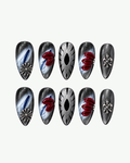 Handmade silver and red almond press-on nails with 3D floral, marbled and chrome-inspired detailing