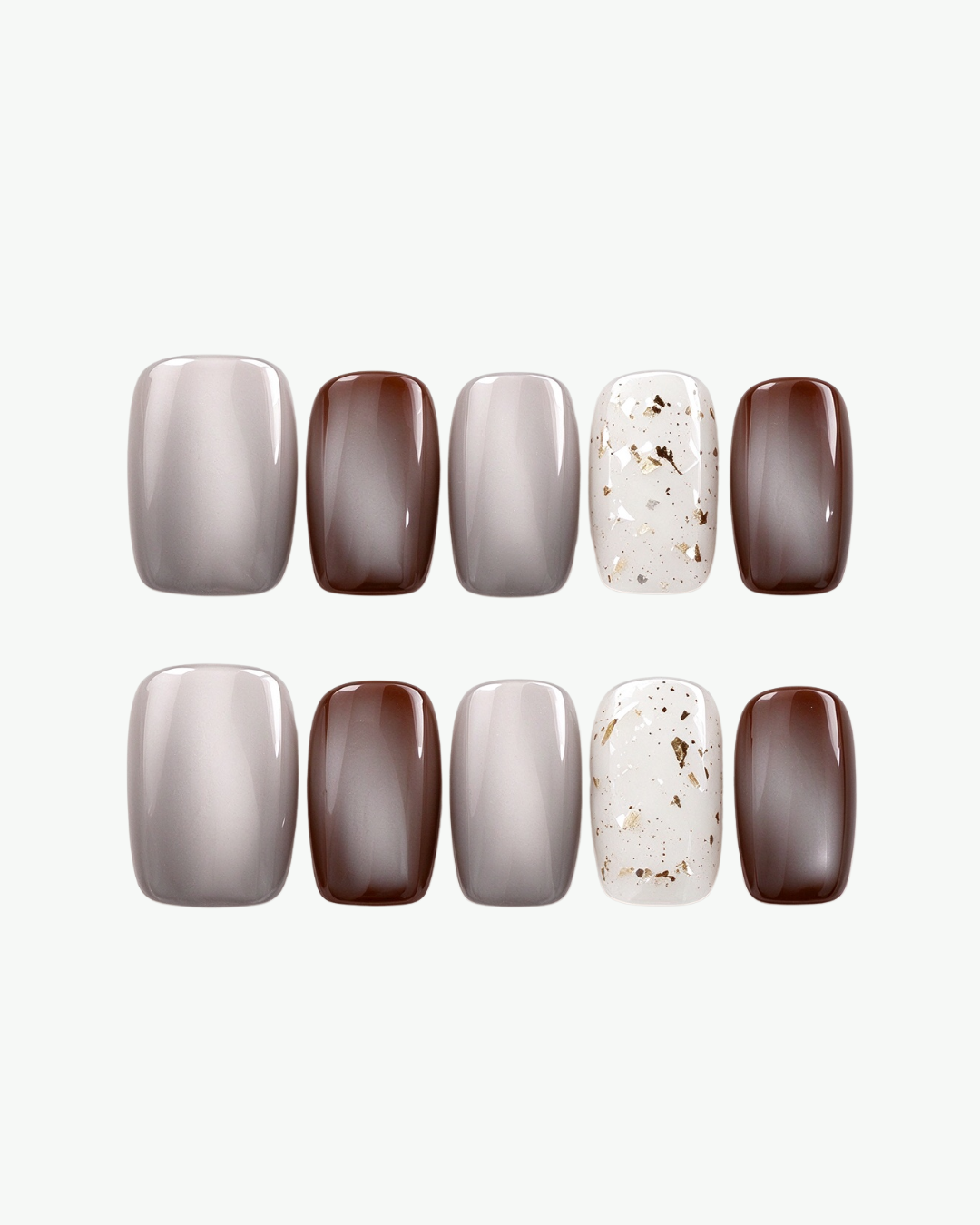 Handmade neutral short squoval press-on nails in smoky grey, mocha brown and white with gold foil accents