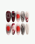 Crimson Web long oval press-on nails with red and black gothic spiderweb detailing