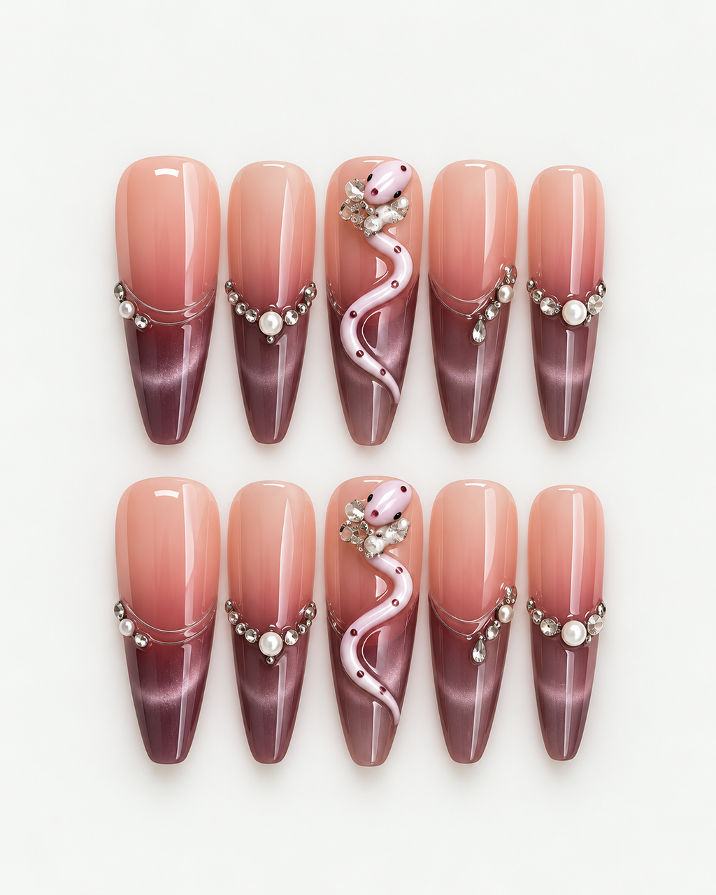 Extra long stiletto press-on nails with blush-to-plum ombre, pink snake detail, pearls and crystal accents