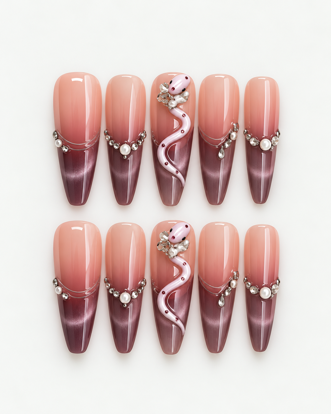 Extra long stiletto press-on nails with blush-to-plum ombre, pink snake detail, pearls and crystal accents